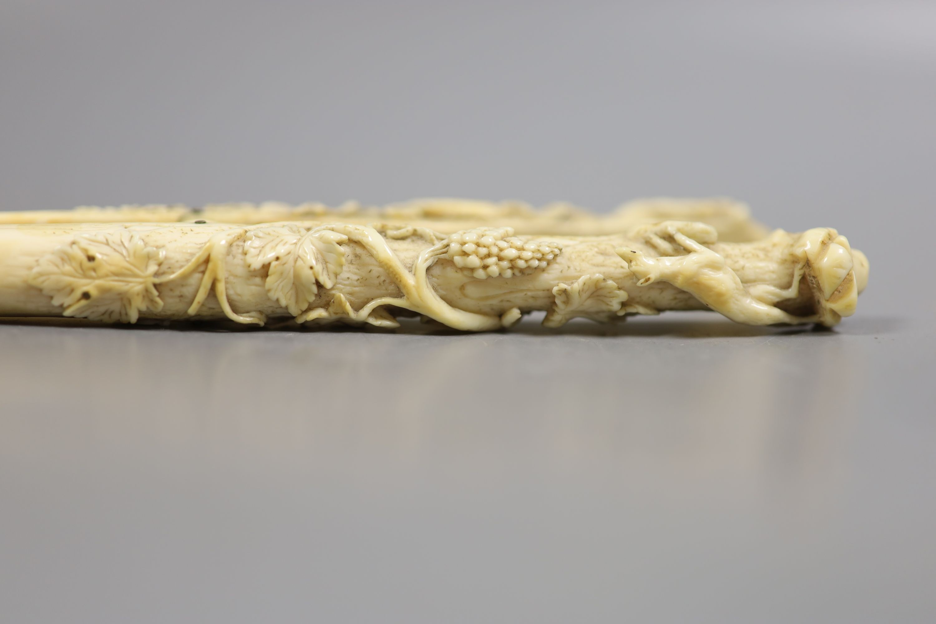 A pair of late 19th century carved ivory glove stretchers